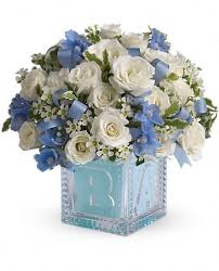 Baby S First Block By Teleflora Blue Baby Shower Flowers New Baby Flowers Flower Arrangements