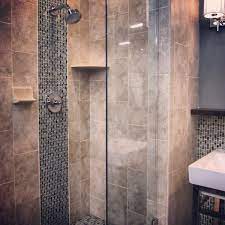 A Glass Mosaic Stripe Adds A Nice Touch Of Design To A Shower Fancy Bathroom Bathroom Design Mosaic Bathroom Tile