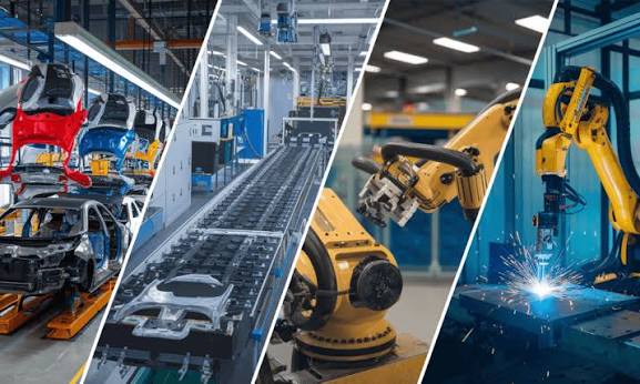 A modern factory floor showing automated conveyor belts and mechanical robotic arms.