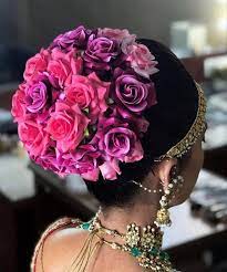 Add Vividness To Your Intimate Wedding With These Colorful Floral Buns Indian Bridal Hairstyles Bridal Hair Buns Hair Styles