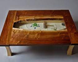 It is believed that the creation of the lines with the small rake frees your mind and gives inspiration and the ability to create. Coffee Table Zen Garden Zen Garden Coffee Table Zen Garden Coffee Table