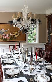 A Stylish Halloween Table Setting Halloween Dining Room Halloween Table Decorations Halloween Table Settings