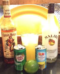This is the easiest way to make the kryptonite cocktail! Captain Malibu Mix Equal Parts Malibu Coconut Rum And Pineapple Juice Splash With Captain Morgan Spiced Rum And Gin Spiced Rum Drinks Coconut Rum Rum Drinks
