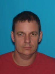 At Large Suspect Charged in West County Homicide