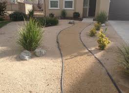 When the granite breaks down, it forms a lot of tiny pieces. Tan Decomposed Granite Left And Right With A Mocha D G Pathway Salt N Pepper Granite Bould Front Yard Landscaping Sidewalk Landscaping Landscaping Supplies