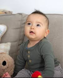 When can baby drink from open cup alone?