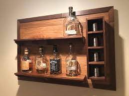 Whether you're looking to add bar shelves to your home bar or a liquor display for your commercial bar, our led lighted bottle displays. Wall Hanging Liquor Display Etsy In 2021 Liquor Display Whiskey Rack Shelves
