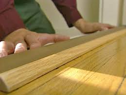 Lay a piece of flooring flat on the subfloor 8. How To Install A Door Threshold With Vinyl Bulb How Tos Diy