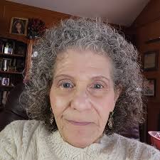 The red rose bush was cut back but Barbra's baby which is pink and came off  that red bush is the only one still blooming!