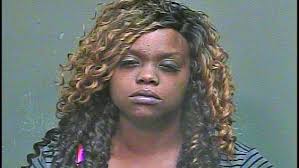 Police: Woman found passed out in drive-thru while children home alone