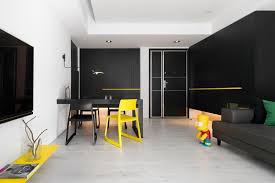 Maybe the main subject has a colorful feature, such as a bright red bow in a. Minimalist Black And White Apartment With Yellow Accents