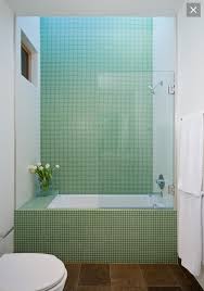 Love This Tiling And The Glass Shower Shield Would Be Lovely With Wood Grain Tiles Skylight Stylish Bathroom Bathroom Design Small Small Bathroom Remodel