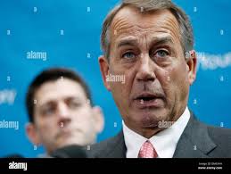 House Speaker John Boehner speaks to Randy Fenske, left, Danielle Wilburn,  between their calls at the NC Victory call center in Raleigh, N.C.,  Saturday, Oct. 13, 2012. Boehner was in town to