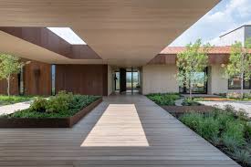 As family life and functional needs expanded, the farmer simply added another cabin and connected the two. Carney Logan Burke Wraps Dogtrot Residence In Weathering Steel To Blend With Wyoming Terrain