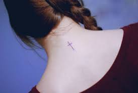 Commonly seen as a religious symbol, the cross can actually symbolize a variety of things for different people. Minimalist Cross Tattoo On The Back Of The Neck
