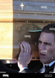 John McAreavey carries the coffin of his wife Michaela Harte, from her  family home in Ballygawley, Northern Ireland, Monday, Jan 17, 2011. Harte,  a 27-year-old teacher, was slain
