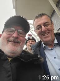 Can you move this guy behind ladies and darken his hair?