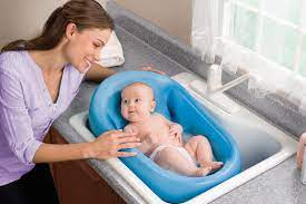 Baby is comfortable and at just the right height to bathe them. Top 10 Baby Bathing Tips Kitchen Sink Baby Bath