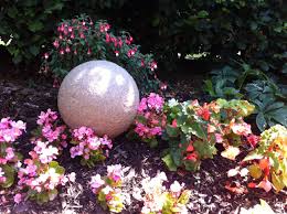 Stone Globe Lights Adding Form And Interest To The Summer Flower Bed Garden Lights Entrance Lighting 12v 230v Entranc Stone Plant Flower Beds Garden Beds