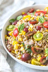 Summer Farro Salad With Tomatoes Basil And Corn Simply Whisked Recipe Vegetarian Salads Farro Salad Farro Recipes
