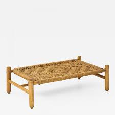 The table is features handwoven rattan with 2 levels of display space to arrange your books or décor in a practical and pretty arrangement. Adrien Audoux Frida Minet Audoux Minet Woven Rope And Wood Coffee Table Or Bench