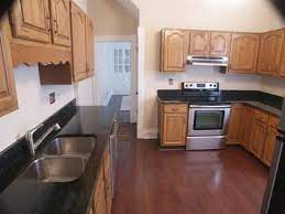 Let's start by listing some of the qualities of oak. Honey Oak Cabinets With Dark Wood Floors Cocinas