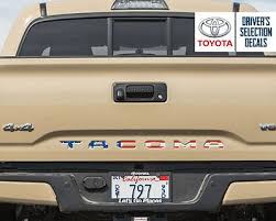 Tacoma's reinforced tailgate — featuring an embossed toyota logo — locks to protect your payload. Toyota Tacoma Tailgate Usa Flag Vinyl Letter Decals Stickers Toyota Tacoma Toyota Toyota Tacoma Accessories