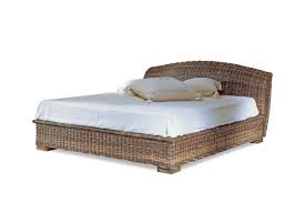 Fit for the boho room of your dreams, this canopy bed is crafted from rattan and mahogany wood in a natural finish, featuring caged paneling along standing base. Rattan Betten Naturlich Schlafen Rattan Center Ch