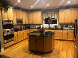 This way the oak cabinetry can gain a beautiful golden glow. How To Update Cabinets With Dark Countertops And Golden Oak Floors