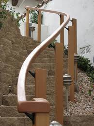Flowing curves that follow the architecture of the staircase. Curved Outdoor Handrail