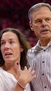 From playing under him to working side by side, Nebraska Volleyball  Operations Director of Operations Lindsay Peterson and Coach John Cook  share a connection built