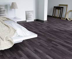 Black Vinyl Flooring In A Wood Grain Pattern Is Gorgeous In This Modern Bedroom Basement Bedroom Flooring Black Vinyl Flooring Vinyl Flooring