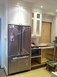 Encapsulate Refrigerator And Bring Countertops Forward For A Custom Built In Look Kitchen Cabinet Remodel Kitchen Refrigerator Cabinet