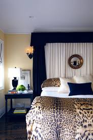 Beautiful Headboard The Leopard Cover Add An Interesting Contrast To The Dark Blue And Comlement The Wall C Home Decor Leopard Home Decor Animal Print Bedroom