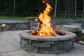 To properly level the natural stone, use a mallet to hit down the high spots. Outdoor Fire Pits How Much Does A Stone Fire Pit Cost Masseo Landscape Inc
