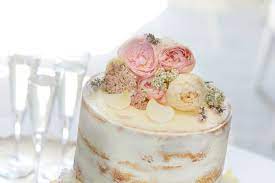 This cake is made in otg. Decorating A Wedding Cake With Edible Flowers Interflora
