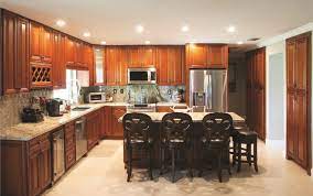 A contemporary kitchen with caramel maple cabinets and seawashed glass wall paint. Get To Know Your Maple Oak Cherry Oak Cabinets The Rta Store