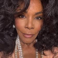 So cute. The proud parents of The Gilded Age star Denée Benton wear  matching T-shirts featuring the character their daughter plays.