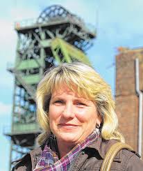 Eine Frau unter Bergmännern