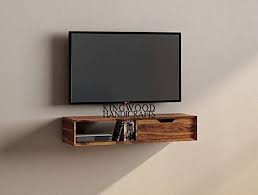 Academic books span a bookshelf's shelves while decorations rest on a wall stand. Kingwood Furniture French Wall Mount Tv Unit Shelf Storage In Solid Wood Sheesham Honey Finish Amazon In Furniture