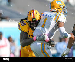 October 21, 2023: Southern quarterback Harold Blood (1) is able to get rid  of the ball before being hit by Bethune Cookman defensive lineman LaQuan  Johnson Jr. (98) 1st half NCAA football