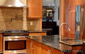 Black And Natural Wood Kitchen Cabinets Natural Cherry Cabinets In Kitchen With Black Granite Prep Sink Pot Filler An Cherry Cabinets Kitchen Trendy Kitchen Backsplash Replacing Kitchen Countertops