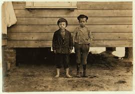 In neighborhood of Maple Mill, Dillon, S.C. Lawrence Faircloth (taller boy)  "Don't know how old I am." Been in mill 2 years. Runs 3 sides Albert  Bartlett (barefoot) Looked 8 years old.