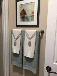 Using two drapery tassels, secure interesting ideas for towel display, ways to decorate coffee tables, hanging artwork and color schemes is creative inspiration for us. How To Hang Bathroom Towels Decoratively Bathroom Towel Decor Towel Display Restroom Decor