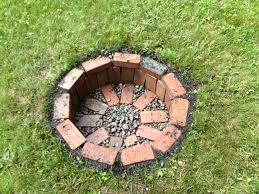 We laid them down onto the ground in the fire pit in a pattern that filled the circle as best as we could. Backyard Fire Pit 4 Easy Steps On How To Make Your Own