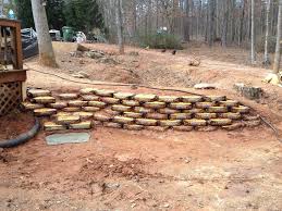Install a straight, continuous row of foundation timbers in this manner. An Easy Way To Build Retaining Walls Leave The Concrete In The Bag Stack Like Legos Wet With A Hose Core77