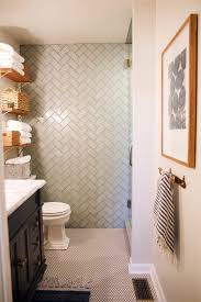 The owners went for a classic colour combo, inspired by a chevron floor, and then had fun adding in accessories in their favourite bright yellow. Chevron Bathroom The Handmade Home