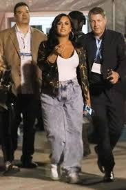 Demi lovato revealed her return to the stage with a performance at the 2020 grammy awards, marking the first time she's performed live since her overdose in 2018. Demi Lovato Donning Completely See Through White Pvc Lace Up Sneakers Demi Lovato Style Demi Lovato Style Outfits Demi