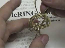 Pull the first ring all the way through the second ring, then turn the second ring up to secure both in place. Puzzle Ring Solution For 6 Band Regular Puzzle Rings 6b141 Youtube