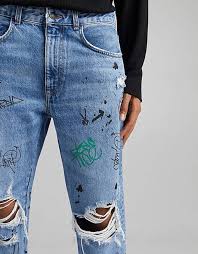 Bershka straight ripped jeans with graffiti print in blue | ASOS